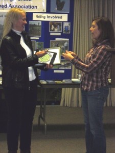 Sue Nielson Receives Award from Katie Finch, Director